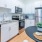 a kitchen with white cabinets