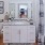 a bathroom with a tub sink and toilet