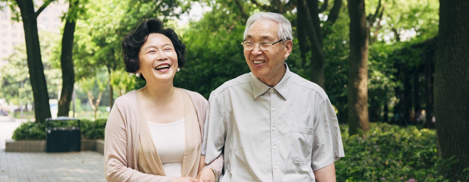 a man and woman standing next to each other and smiling