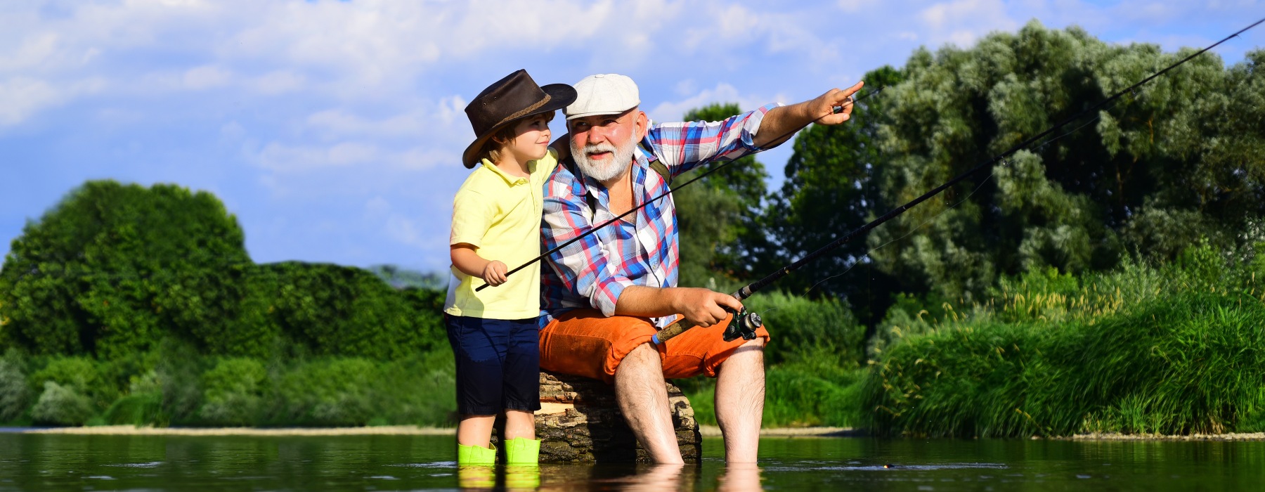 a grandpa and grandson fishing