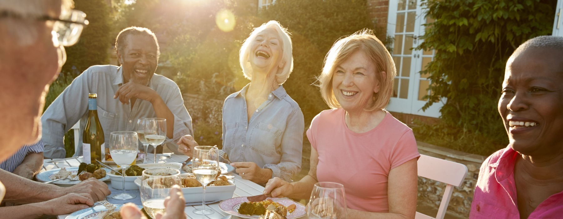 a group of friends laughing outdoors