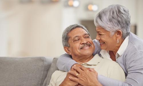 an older couple hugging