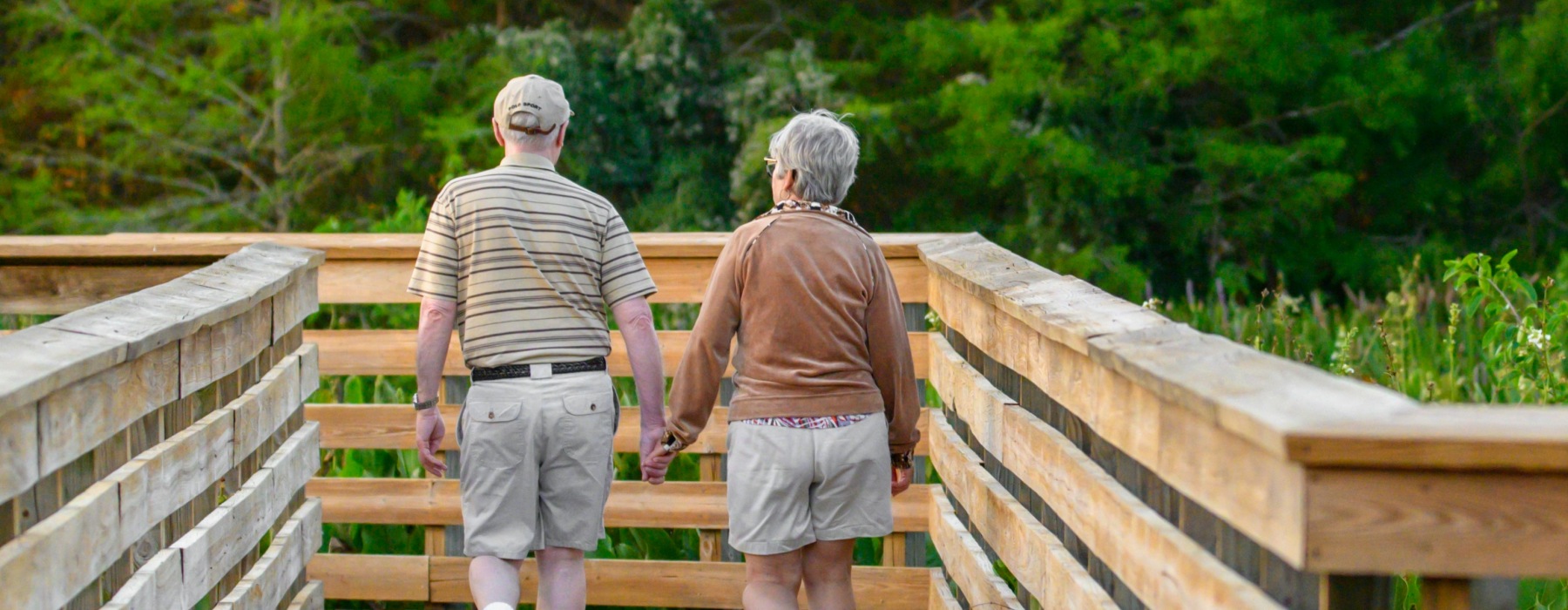 an older coupe walking on a bridge